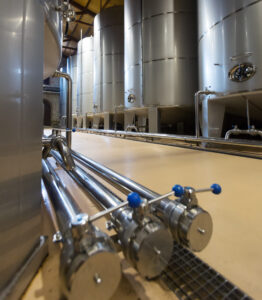 contemporary stell barrels in winery Rows of contemporary stell barrels in winery